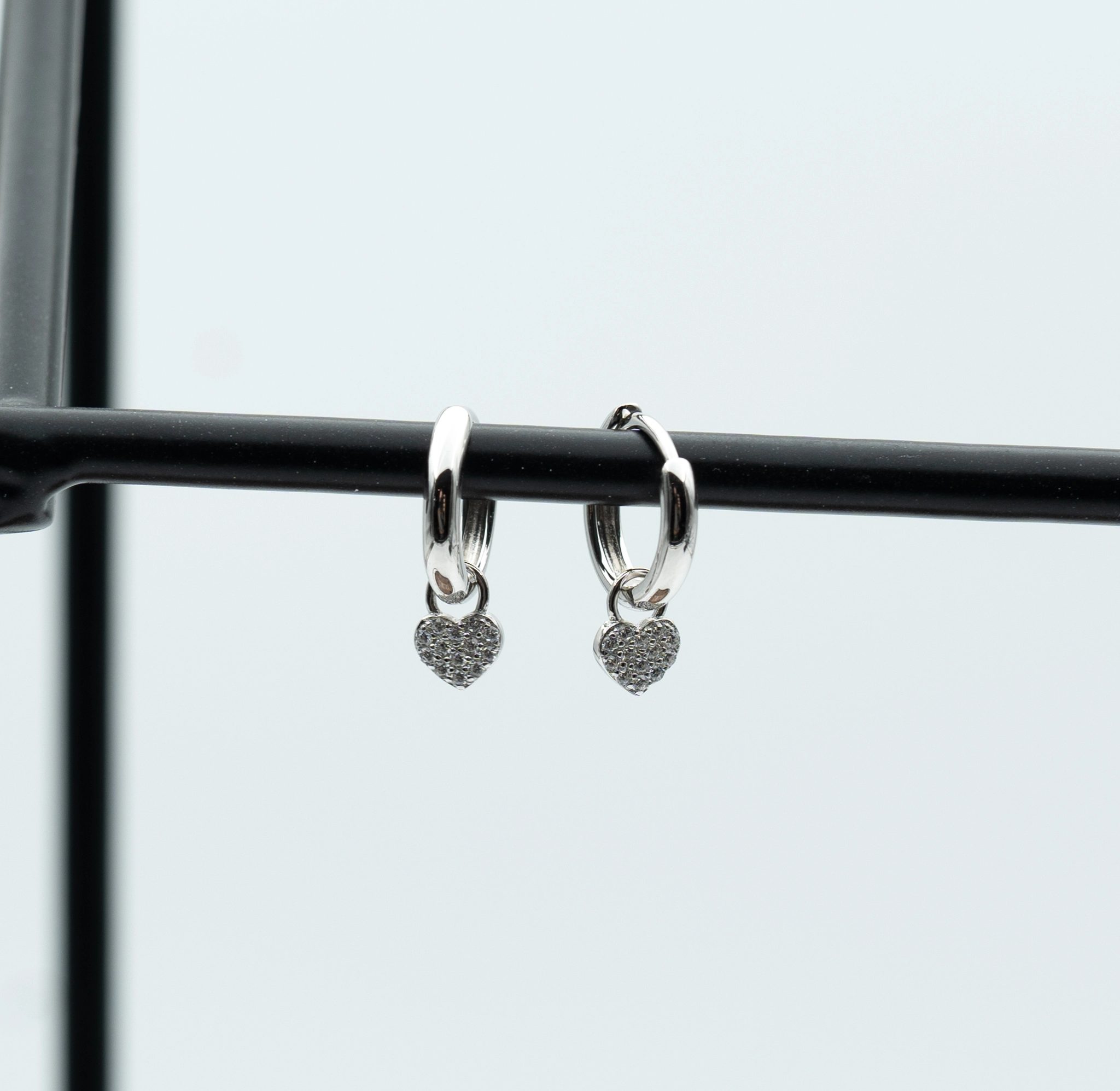 Charming: Sterling Silver Huggie Hoop Earrings with Pave Heart Charms - Portier Jewelry Charming: Sterling Silver Huggie Hoop Earrings with Pave Heart Charms - Image 3